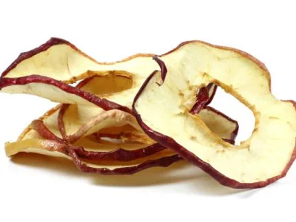 homemade dried apple rings isolated on white background